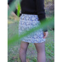 jupe courte bleue à fleurs, jupe portefeuille, jupe reversible, jupe droite, jupe boutonnée, jupe asymetrique